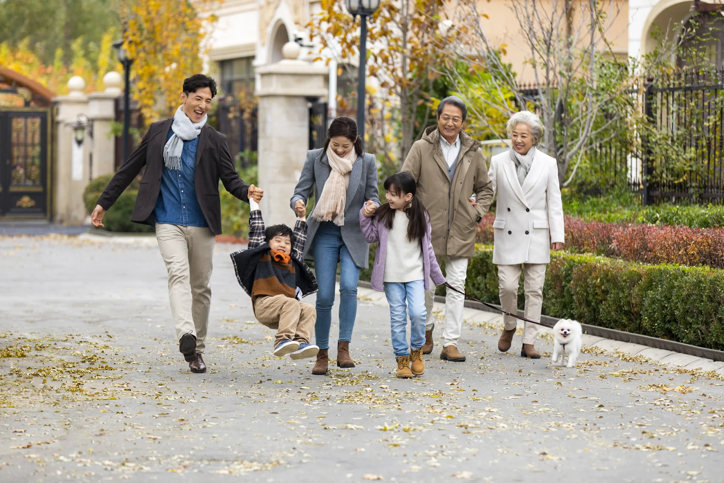 Multigenerational family walking together outdoors
