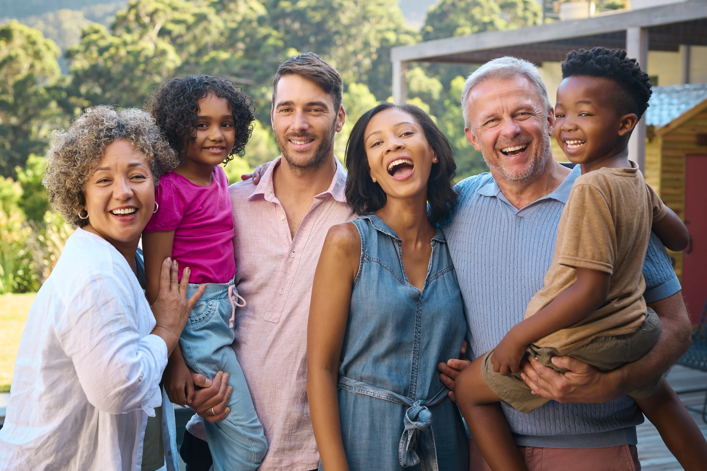 Multi-generational family together outdoors