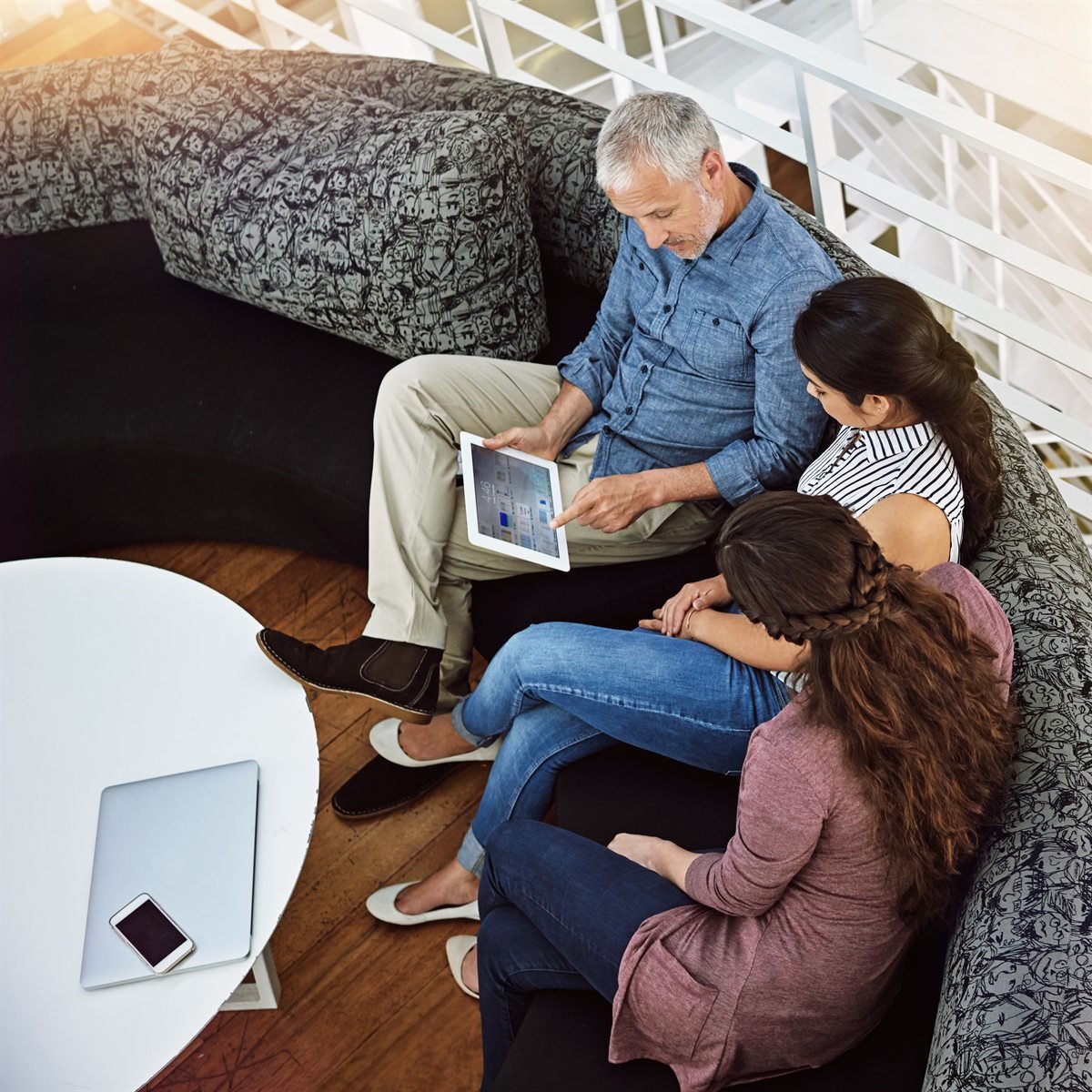 A family reviewing Medicare plan information together on a tablet